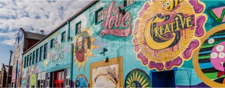 Colorful wall mural on the outside of the K12 & Tejas Gallery