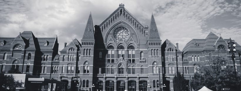 Cincinnati Music Hall’s ornate red-brick façade with large arched windows and rose window.